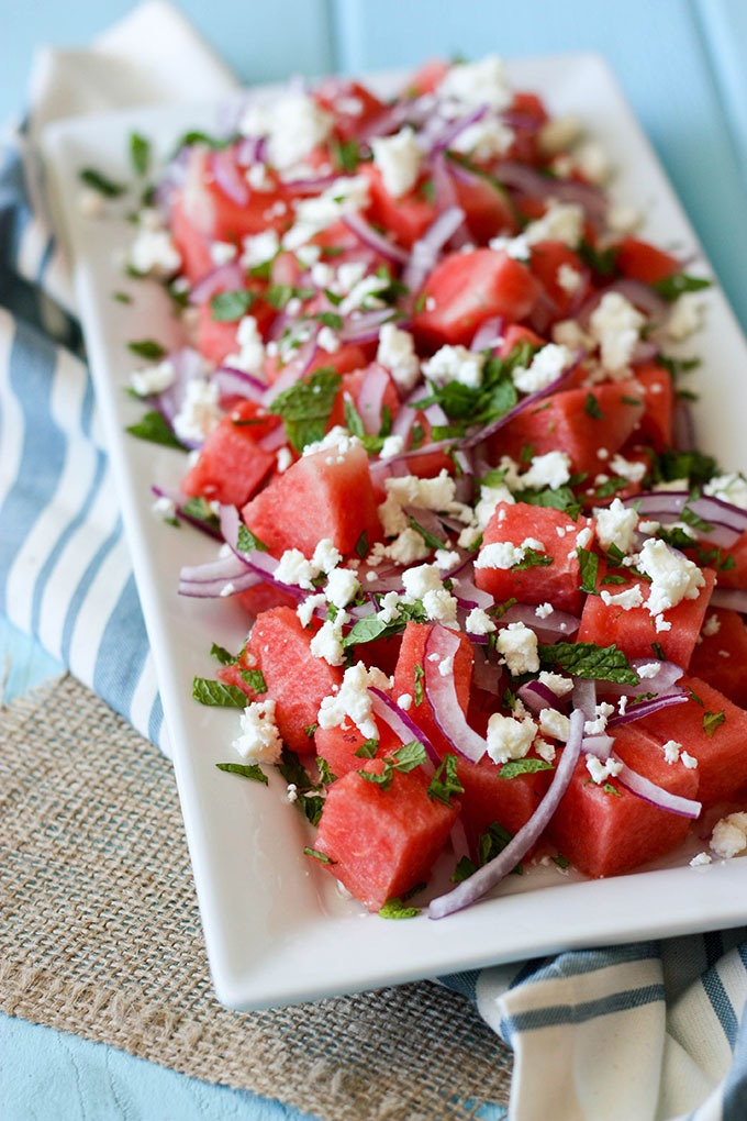 watermelon mint feta salad on white long plate