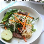 Pinterest graphic - 'Vietnamese beef salad' text on white banner at top of image of the salad in a bowl