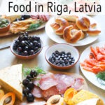latvian style charcuterie board on wooden table with 'the ultimate guide to food in riga, latvia' text on top of image