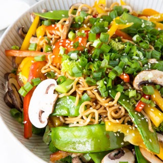 asian noodle salad in large white bowl