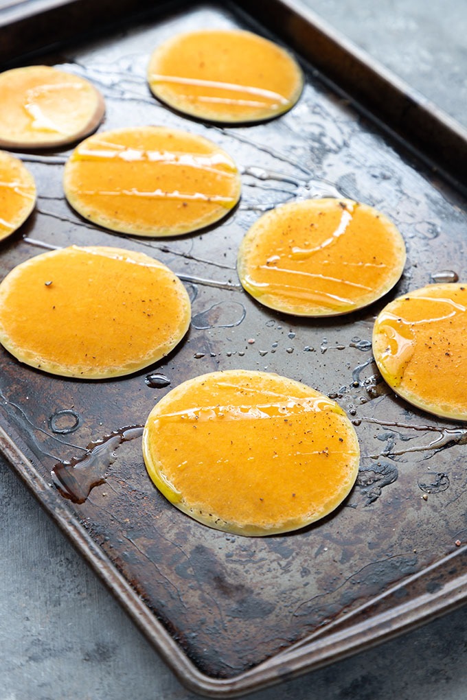 slices of butternut squash on a baking tray