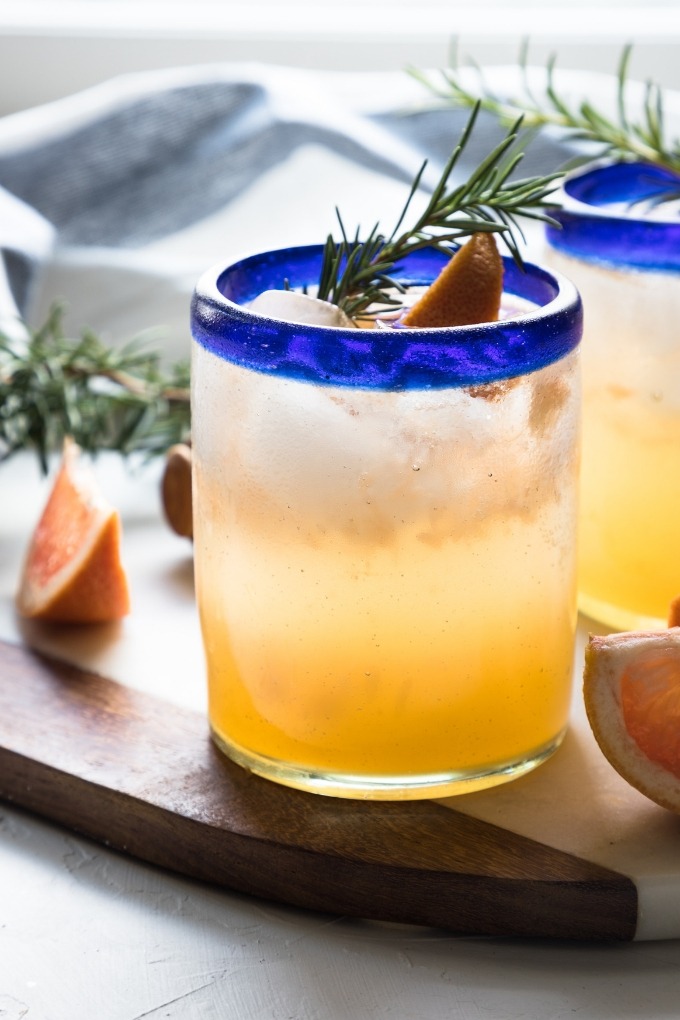 15 fall cocktails - grapefruit gin cocktail in blue and clear glass