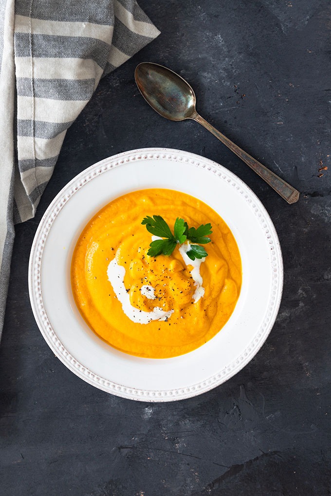 single bowl of carrot and ginger soup 