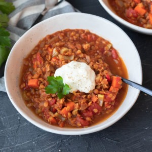 spicy lentil soup in white bowl