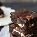 image of brownies on plate with text the best chocolate chip brownies at top of image