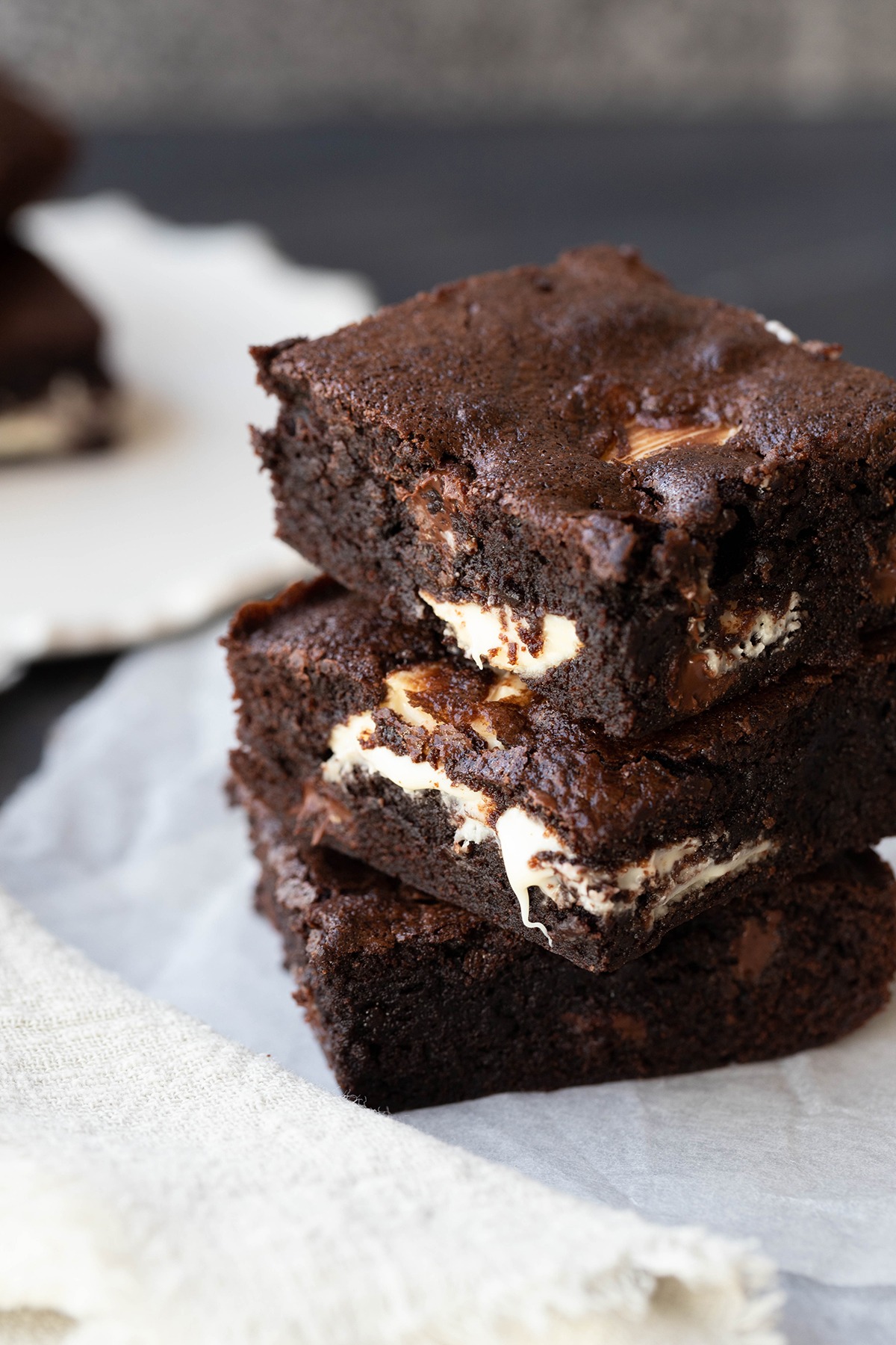 triple chocolate brownies on a white plate 