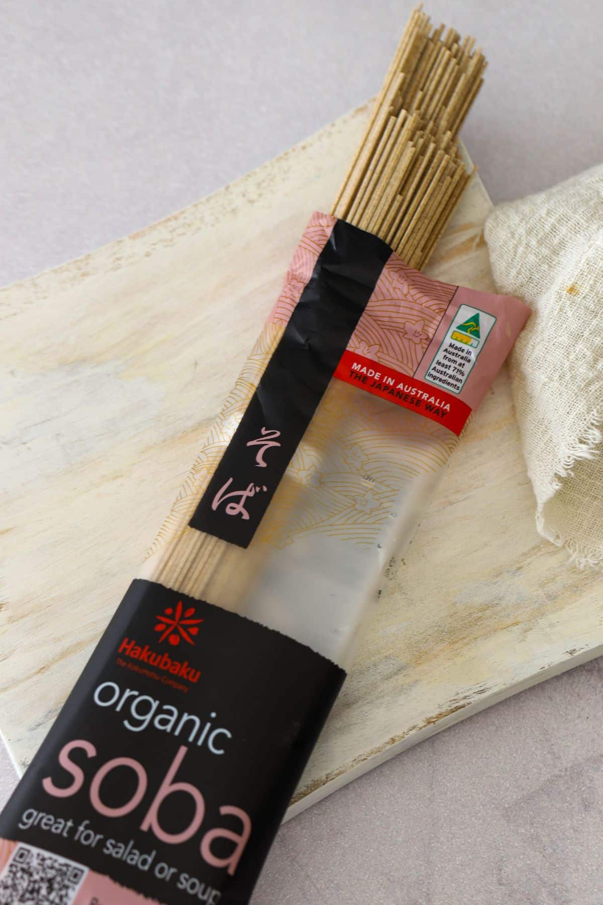 soba noodles in a packet on a white board with white cloth