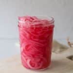 red pickled onion in glass jar