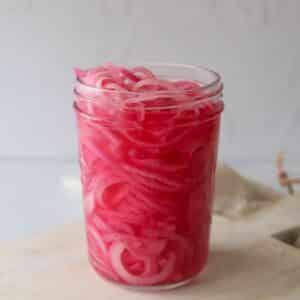 red pickled onion in glass jar