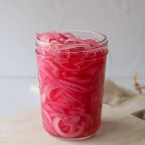 red pickled onion in glass jar