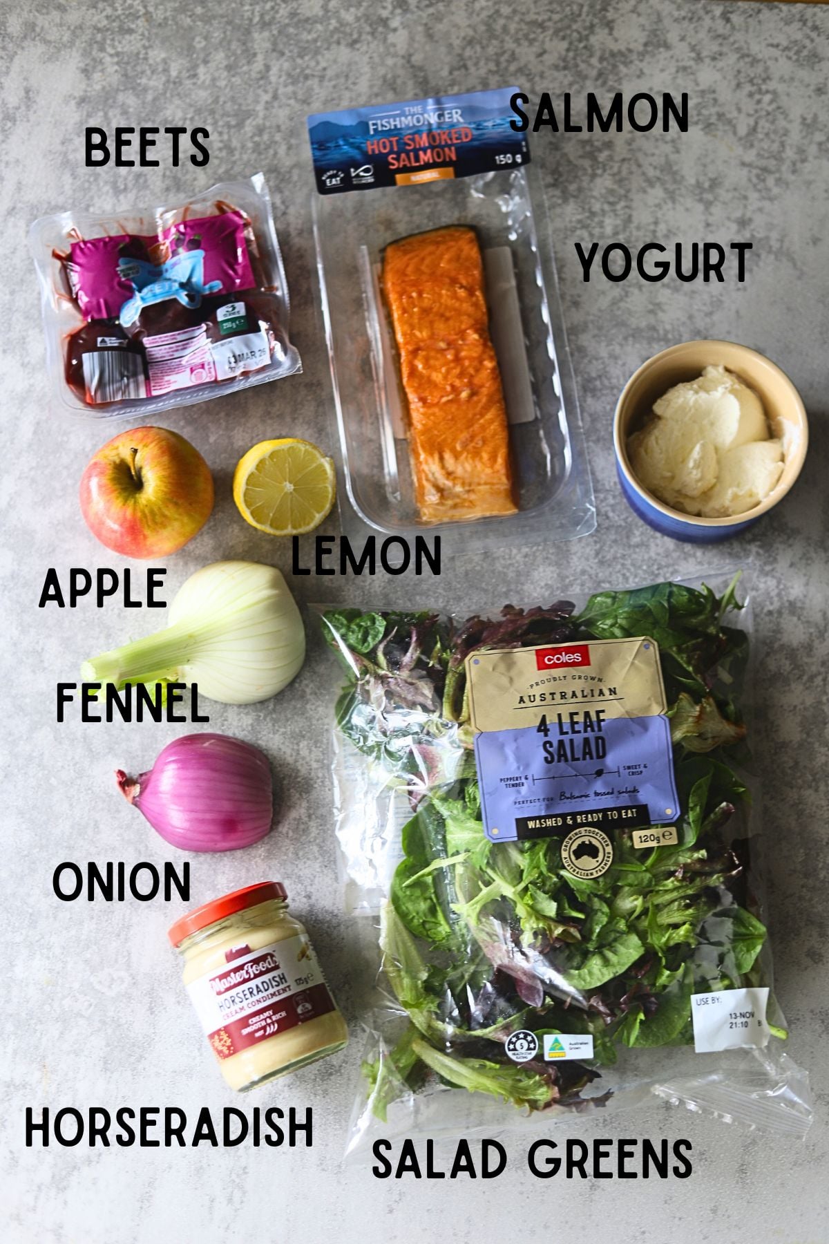 key ingredients laid out on board. From top to bottom, left to right - beetroot, salmon, yogurt, apple, fennel, onion, greens, horseradish cream.