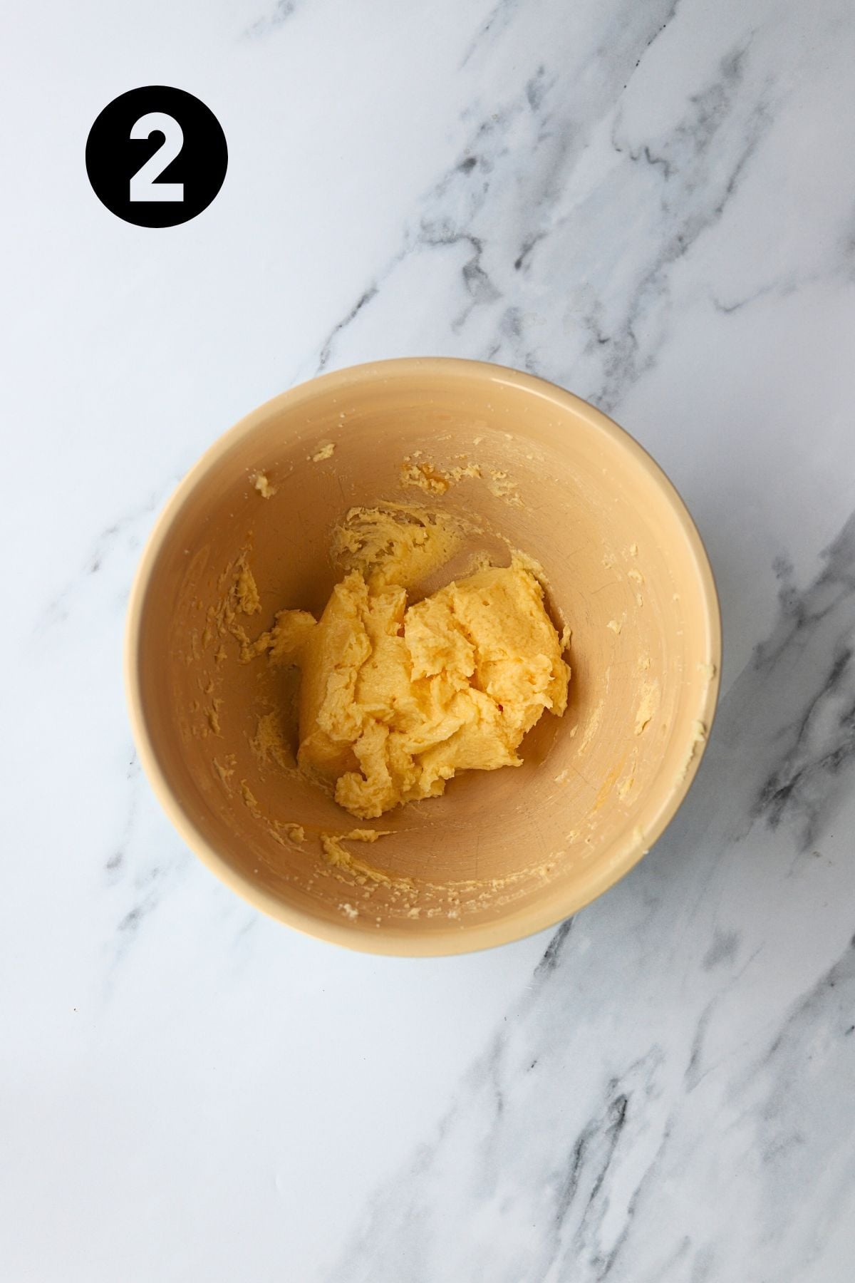 egg and vanilla added to sugar and butter and mixed well.