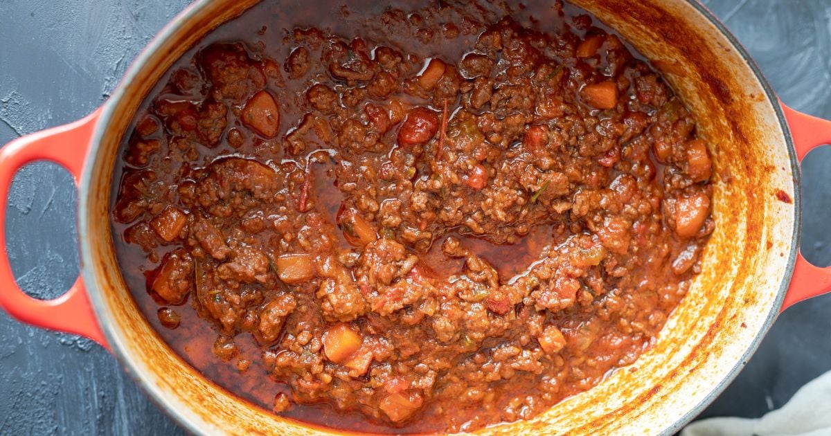 cooked lamb ragu in dutch oven.