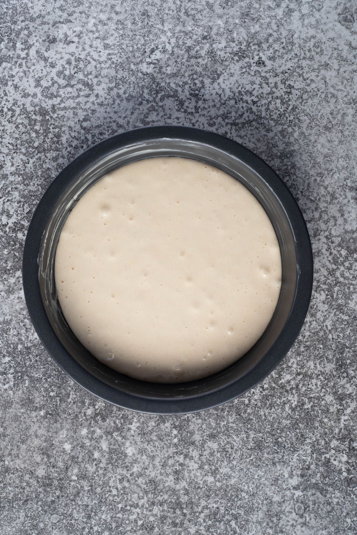 cake batter poured into prepared tin.