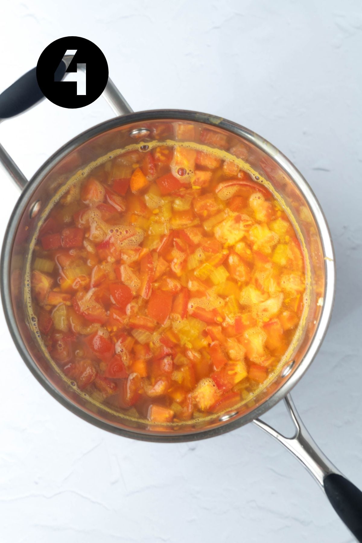 tomato, carrot added to the saucepan.