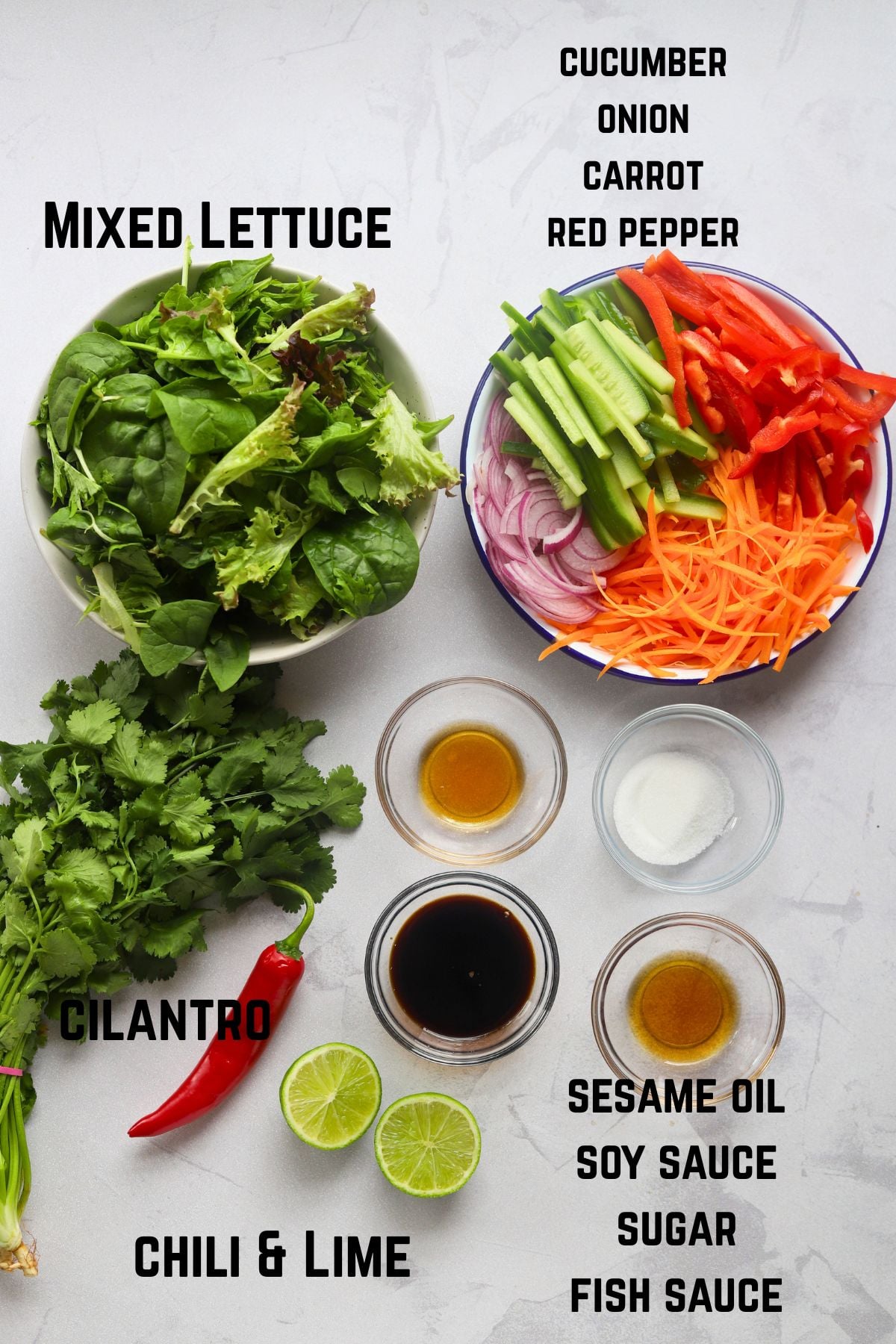 all Thai Salad ingredients in small bowls on a large board.