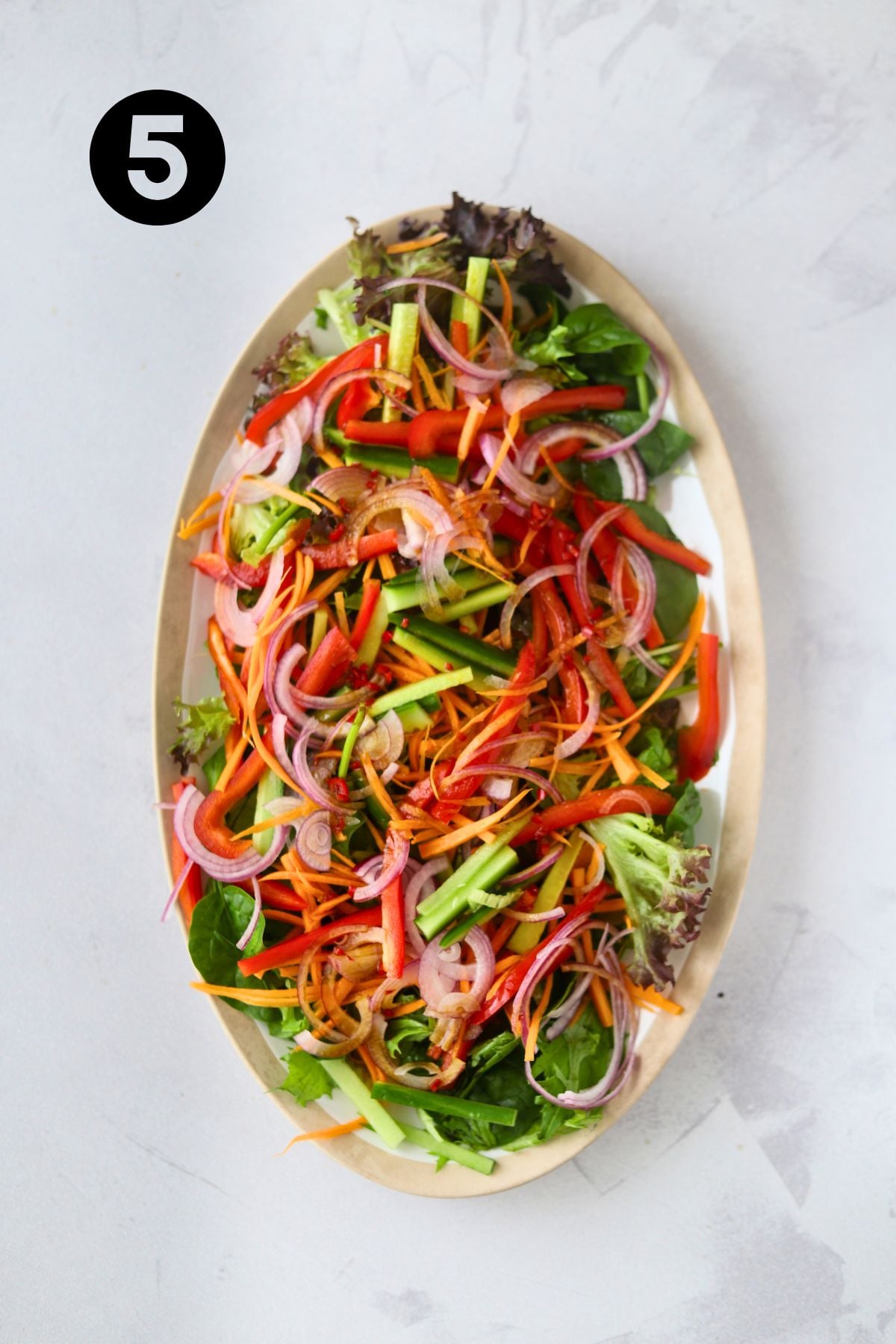 Dressing tossed through the salad.